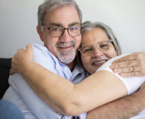 Happy Elderly Couple Embracing in Assisted Living Sugar Land TX Happy Elderly Couple Embracing in Assisted Living Sugar Land TX