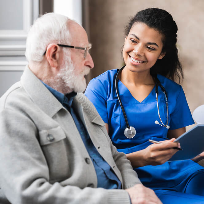 Caregiver Comforting Resident at Assisted Living Facility